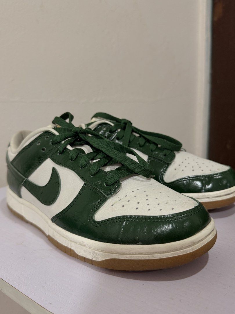 Nike Dunk Low Ostrich Green (Category: Sneakers) located in Manila. Submitted by activepeach (Listing ID 1462862125, Image 1). Description: - Classic Nike Dunks - Colorway: Green and White - Features a gum sole - Green laces - Perforated toe box - Ideal for casual wear - Minor signs of wear on sole and leather.