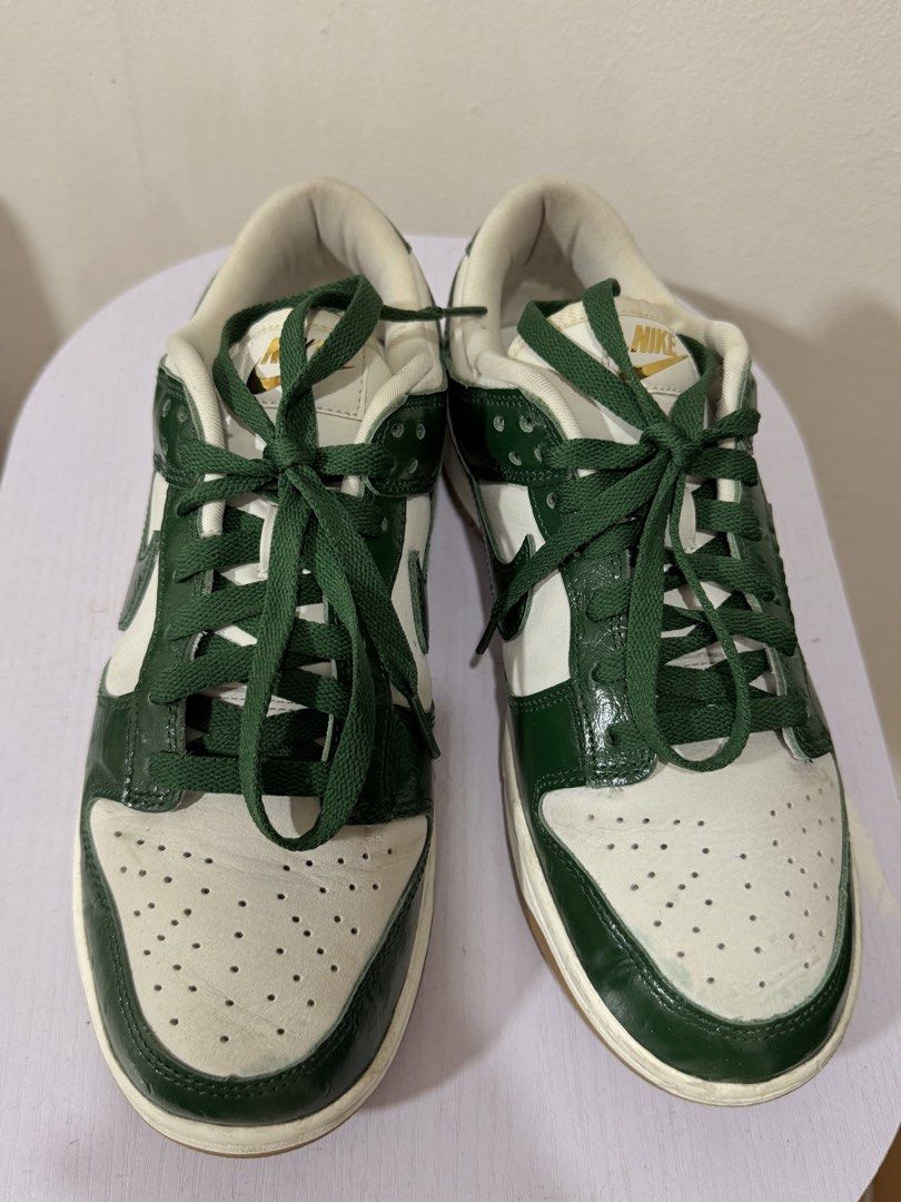 Nike Dunk Low Ostrich Green (Category: Sneakers) located in Manila. Submitted by activepeach (Listing ID 1462862125, Image 2). Description: - Classic Nike Dunks - Colorway: Green and White - Features a gum sole - Green laces - Perforated toe box - Ideal for casual wear - Minor signs of wear on sole and leather.