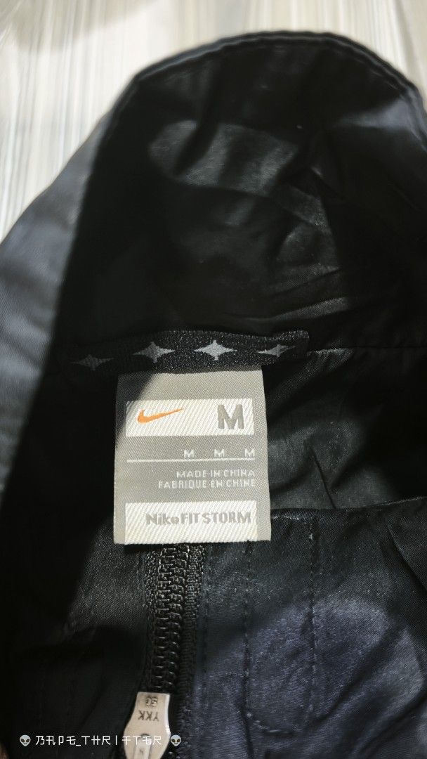 Nike Fit Storm Jacket Black Grey Size M (Category: Coats, Jackets and Outerwear) located in Lingayen. Submitted by c7quiter84444 (Listing ID 1462849140, Image 3). Description: - Nike Fit Storm Jacket - Size: Medium - Color: Black with grey side panels - Features: Lightweight, water-repellent - Ideal for: Outdoor activities, running, casual wear - Origin: Made in China.