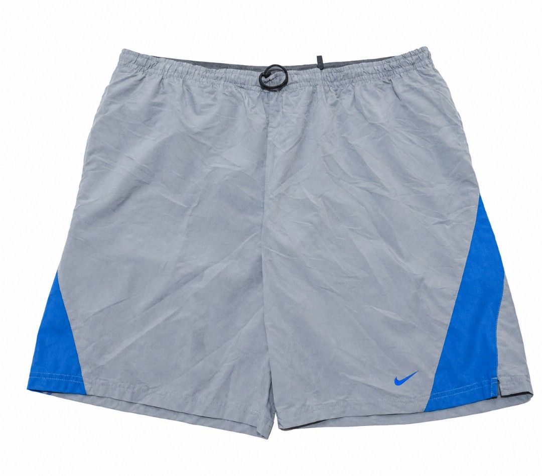 Nike Grey Blue Athletic Shorts (Category: Shorts) located in Quezon City. Submitted by aljonbermu25659 (Listing ID 1462685761, Image 1). Description: - Grey Nike shorts - Blue accents on the sides - Elastic waistband with drawstring - Lightweight material - Ideal for sports or casual wear - Small Nike logo on the front.