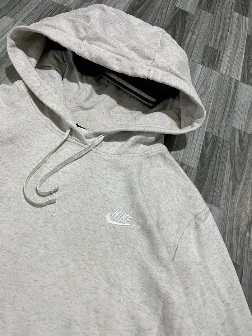 Nike Grey Pullover Hoodie Sweatshirt (Category: Coats, Jackets and Outerwear) located in Cavite. Submitted by arespichri90266 (Listing ID 1462699933, Image 2). Description: - Grey Nike Hoodie - Size XL (25x26) - Small embroidered Nike logo on chest - Drawstring hood - Front pocket - Ideal for everyday wear - issue: Minimal pink stain (not very visible) .