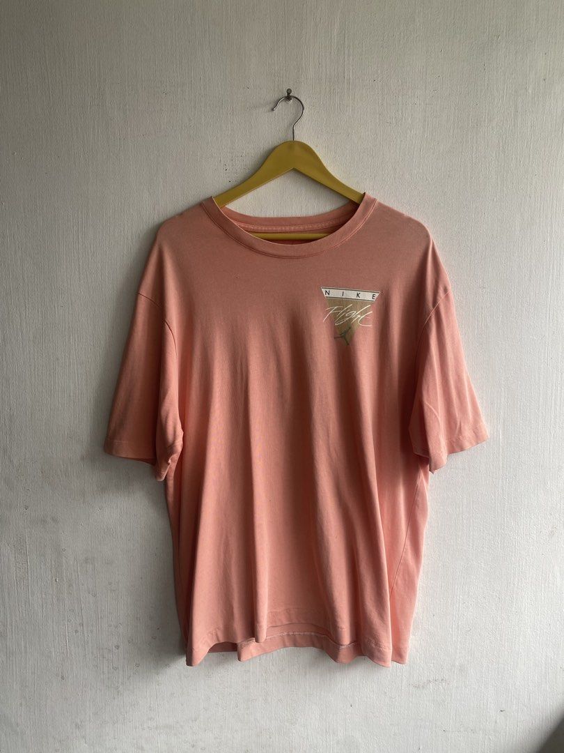 Nike Jordan Flight Graphic T-Shirt (Category: Tshirts & Polo Shirts ) located in Manila. Submitted by anthony1723 (Listing ID 1462716199, Image 1). Description: - Peach colored Nike Jordan T-shirt - Features 'Nike Flight' graphic on the front - Basketball hoop graphic on the back - Size: Medium (M) - Ideal for casual everyday wear.
