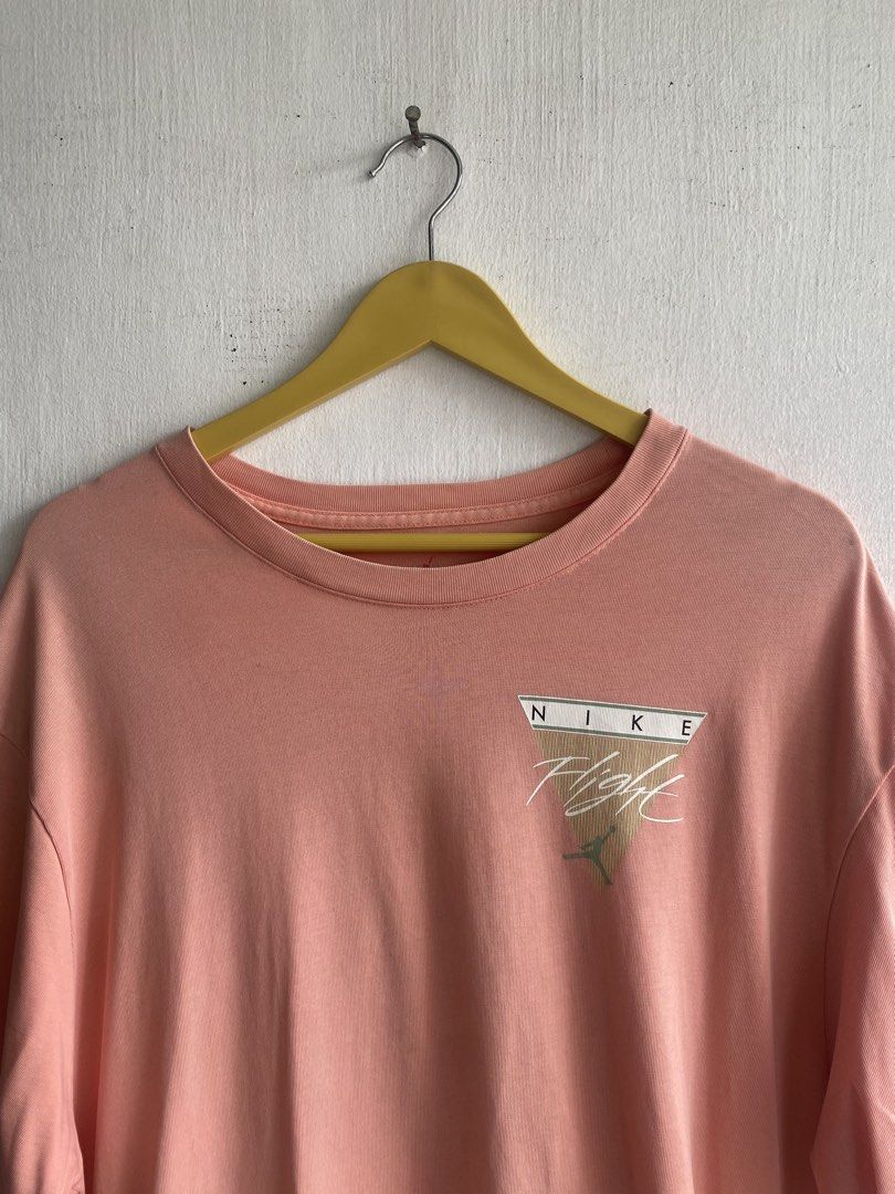 Nike Jordan Flight Graphic T-Shirt (Category: Tshirts & Polo Shirts ) located in Manila. Submitted by anthony1723 (Listing ID 1462716199, Image 2). Description: - Peach colored Nike Jordan T-shirt - Features 'Nike Flight' graphic on the front - Basketball hoop graphic on the back - Size: Medium (M) - Ideal for casual everyday wear.