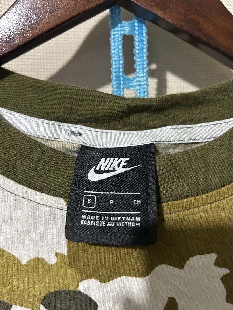Nike NSW camou Tee (Category: Activewear) located in Santa Rosa. Submitted by unexpected.finds4026 (Listing ID 1462877706, Image 3). Description: Small on tag 20 W 23 L best fit to Small - Medium complete tags authentic no flaws .