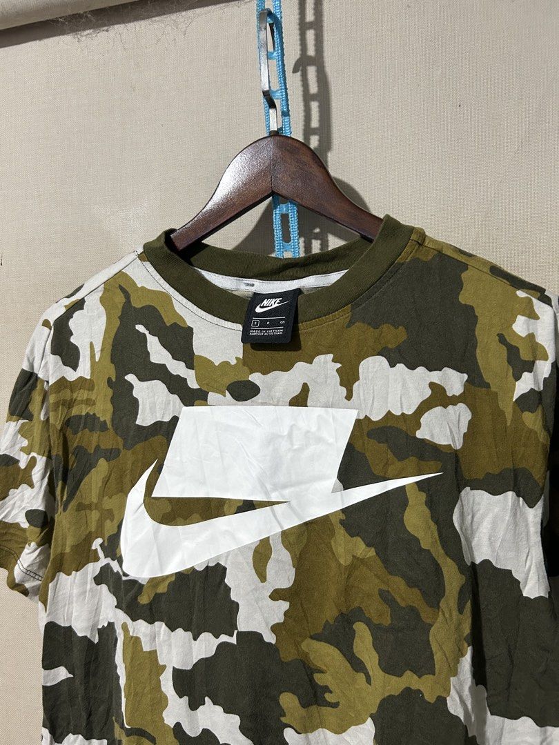 Nike NSW camou Tee (Category: Activewear) located in Santa Rosa. Submitted by unexpected.finds4026 (Listing ID 1462877706, Image 2). Description: Small on tag 20 W 23 L best fit to Small - Medium complete tags authentic no flaws .
