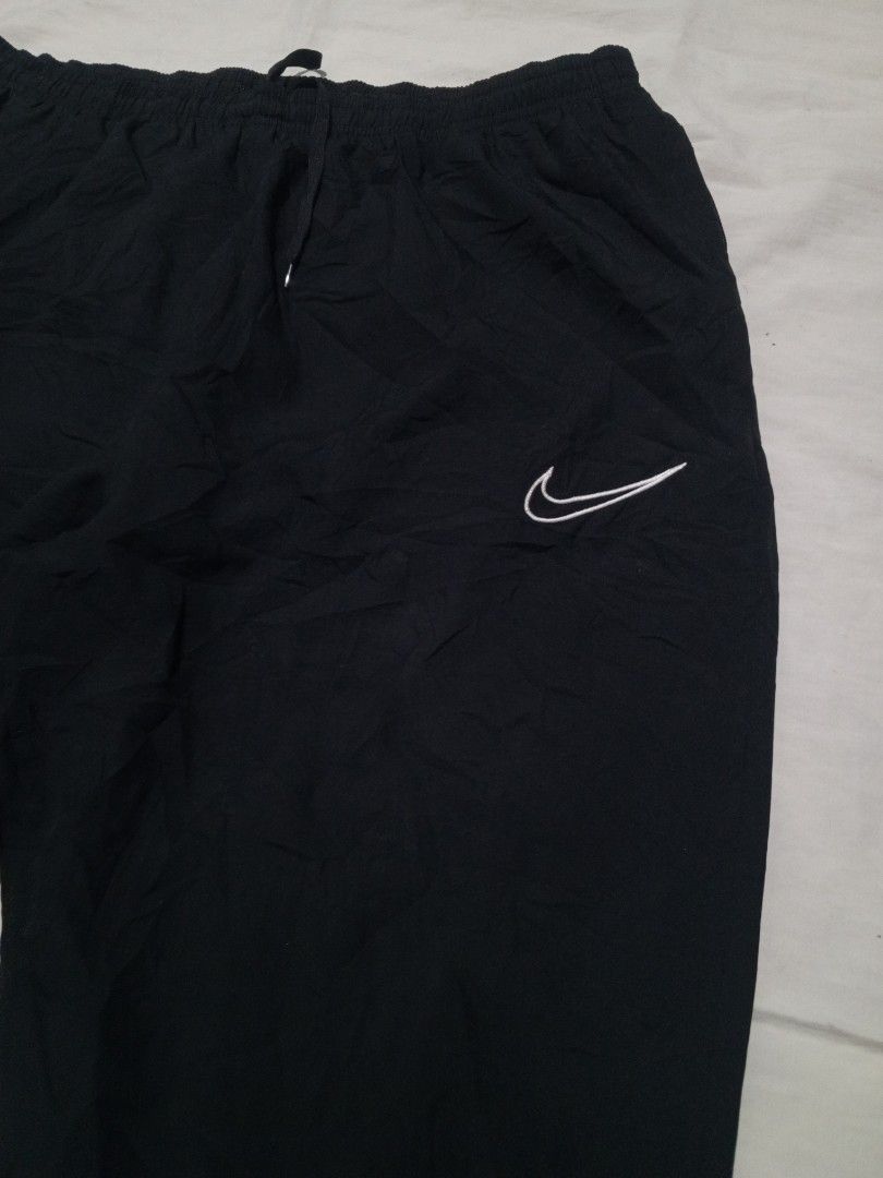 Nike nylon Trackpants (Category: Joggers) located in Santa Maria. Submitted by paulo-garcia21 (Listing ID 1462806624, Image 3). Description: xxl on tag width 32 by 42 length 39.5 inseam 27 thight 13.