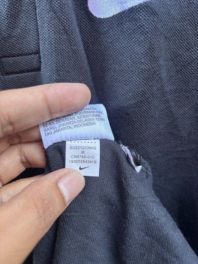 Nike Polo Shirt Black Size M (Category: Tshirts & Polo Shirts ) located in Manila. Submitted by thriftkibs (Listing ID 1462827648, Image 3). Description: - Black Nike Polo Shirt - Size: Medium (M) - Material: 100% Cotton - Origin: Made in China - Features: Embroidered Nike logo on chest, two-button placket - Ideal for: Casual wear.