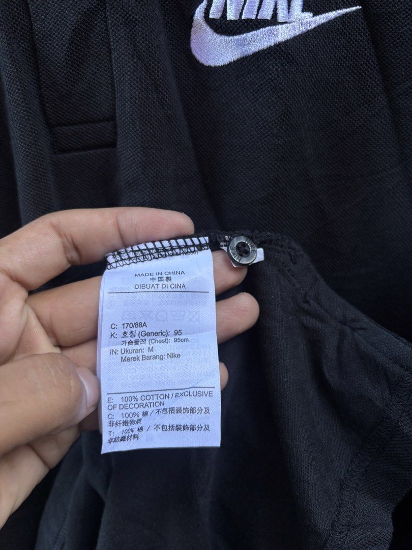 Nike Polo Shirt Black Size M (Category: Tshirts & Polo Shirts ) located in Manila. Submitted by thriftkibs (Listing ID 1462827648, Image 2). Description: - Black Nike Polo Shirt - Size: Medium (M) - Material: 100% Cotton - Origin: Made in China - Features: Embroidered Nike logo on chest, two-button placket - Ideal for: Casual wear.