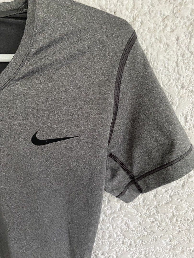 Nike Pro Dri-FIT Grey Training T-Shirt, medium (Category: Activewear) located in Paranaque City. Submitted by dessells_ (Listing ID 1462759479, Image 3). Description: - Grey Nike Pro Dri-FIT T-shirt - Size: Medium (M) - Short sleeves, crew neck design - Made in Cambodia - Ideal for workouts and everyday comfort - Features breathable and comfortable Dri-FIT material.