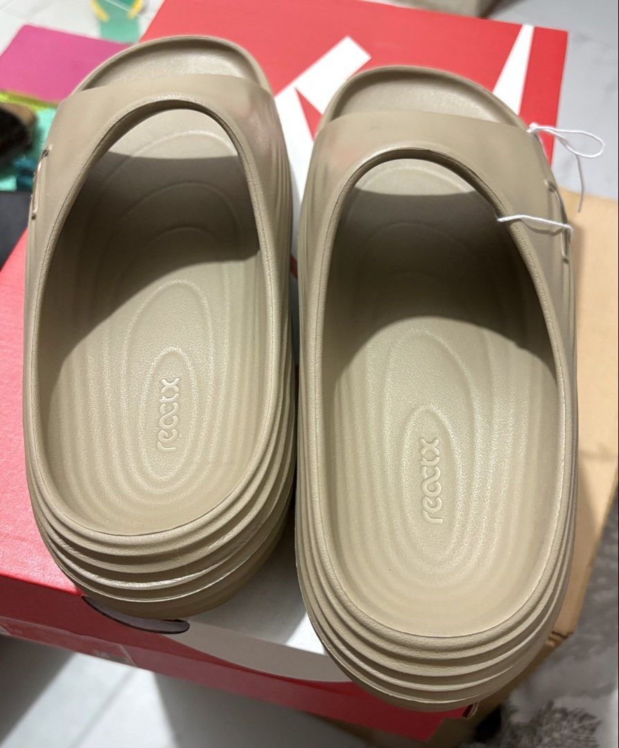 Nike ReactX Rejuven8 slide mens us9 (Category: Slippers & Slides) located in Manila. Submitted by shoepatos4u (Listing ID 1462840864, Image 3). Description: Mens us9/27cm/42.5eur The ReactX upper and midsole surround your feet in soft, responsive comfort. The sticky rubber outsole adds grip even on slick surface The extra room at the forefoot helps accommodate various foot widths.