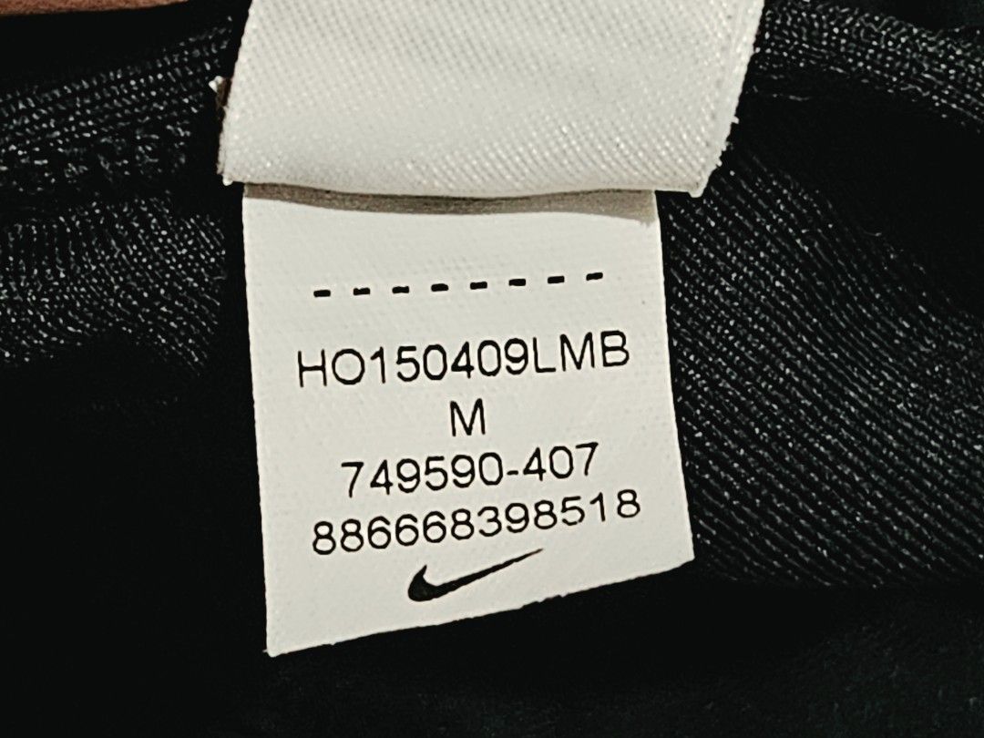 Nike Sports Bra Medium Blue/Black/White Pattern (Category: Activewear) located in Quezon City. Submitted by randzcruz (Listing ID 1462686005, Image 3). Description: Nike sports bra, size M. Features a stylish blue, black, and white abstract design with a supportive racerback. Made with recycled materials for a sustainable choice..