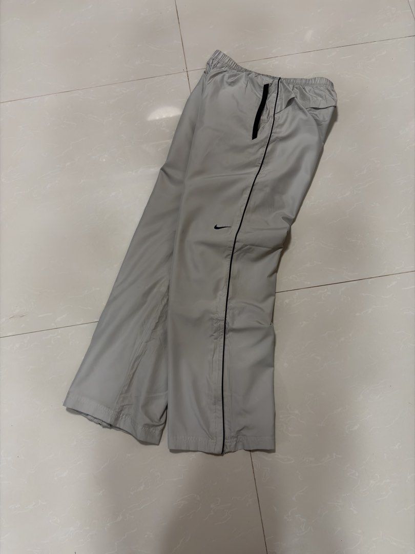 Nike Track Pants Grey L Zip Bottoms (Category: Joggers) located in Caloocan City. Submitted by puremountain.2e6573 (Listing ID 1462860906, Image 1). Description: - Grey Nike track pants - Size L (fits 150-160cm height) - Elastic waistband with drawstring - Full zip on the sides of the legs - Small Nike swoosh logo on the left leg - Made in China.