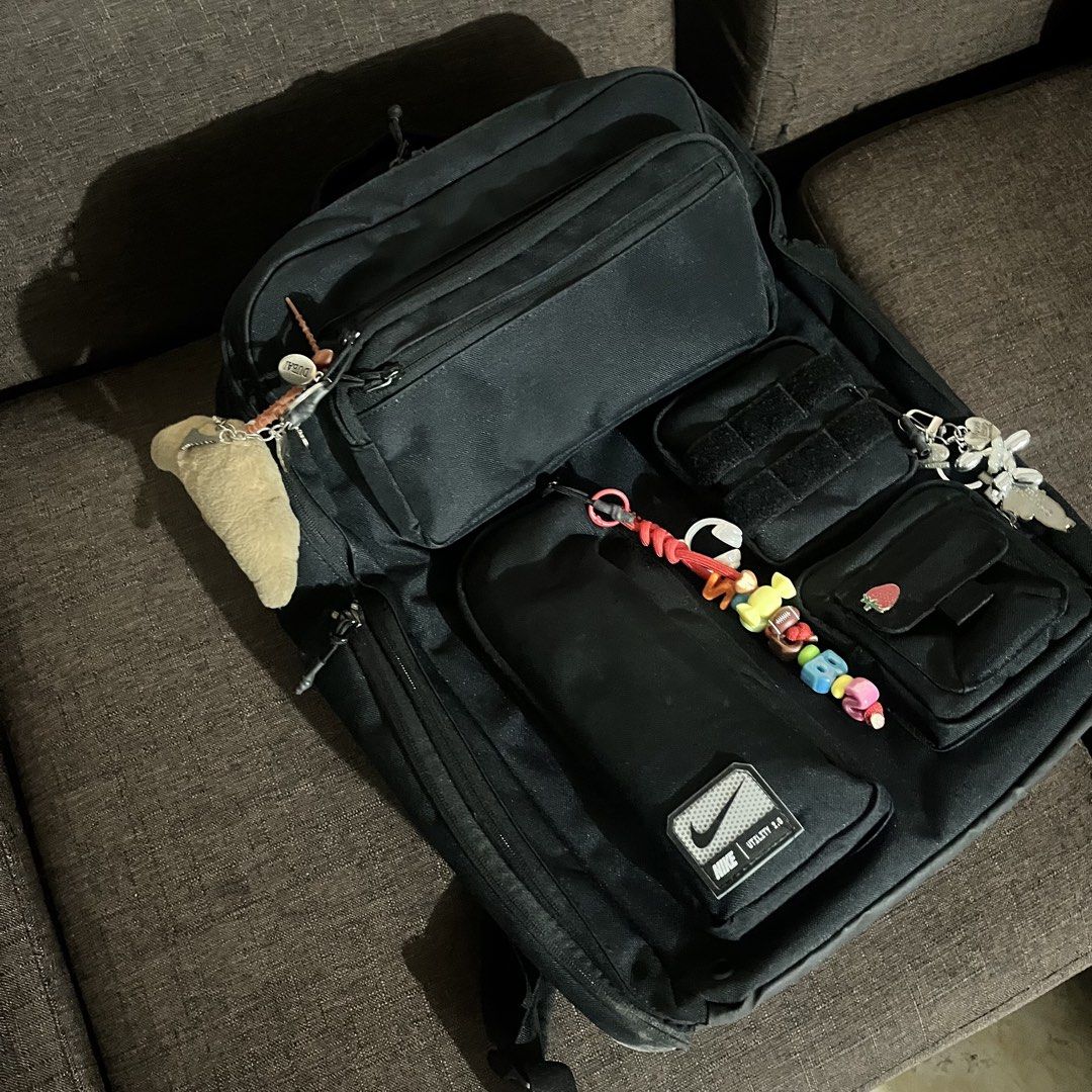 Nike Utility 2.0 Backpack Black (Category: Backpacks) located in Manila. Submitted by kimsunnycart (Listing ID 1462732894, Image 1). Description: - Black Nike Utility 2.0 backpack - Multiple pockets and compartments for excellent organization - Padded laptop sleeve inside - Adjustable padded straps for maximum comfort - Ideal for school, work, or travel - Includes cute keychains and pins - Ready for its next adventure! 6k orig price .