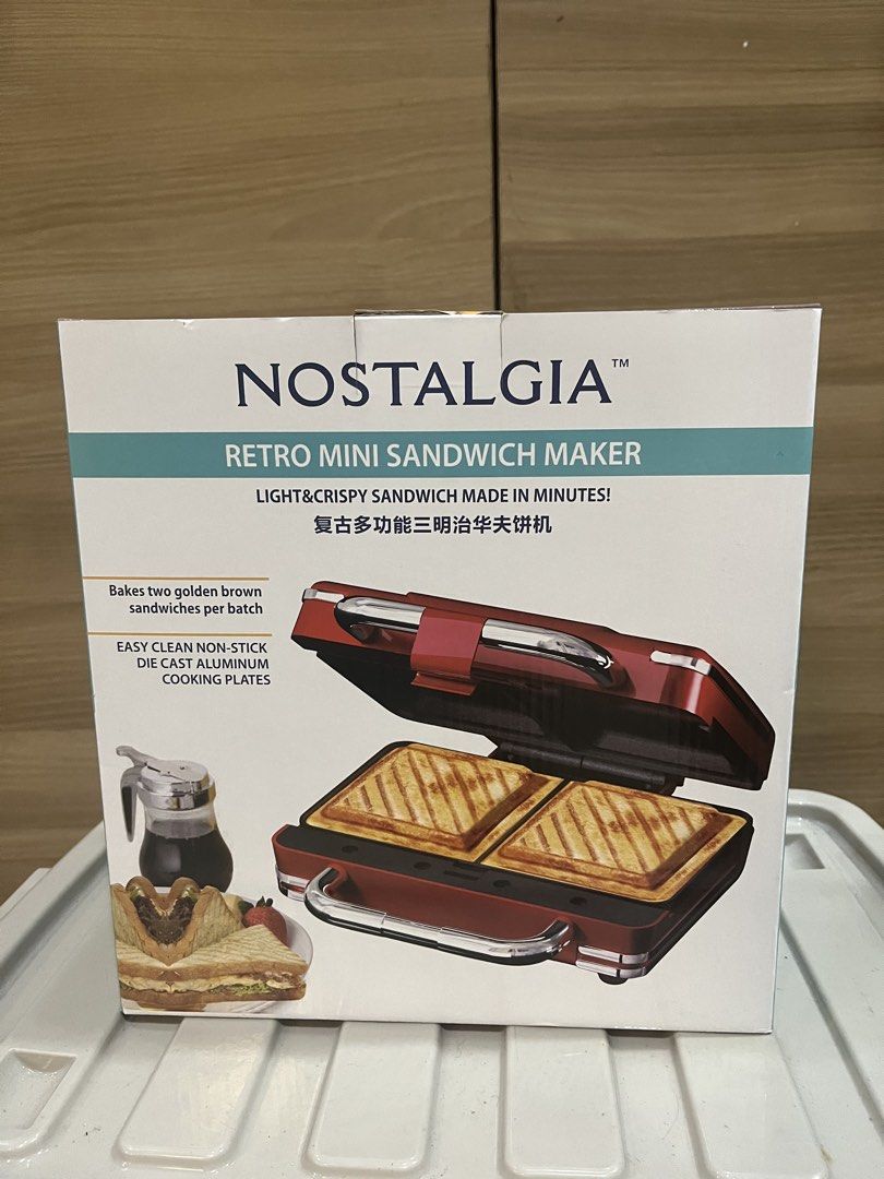 Nostalgia Retro Mini Sandwich Maker - Bakes 2 Sandwiches (Category: Other Kitchenware & Tableware) located in Manila. Submitted by jericho_chan (Listing ID 1462721145, Image 1). Description: - Bake 2 golden brown sandwiches in minutes! - Easy-clean non-stick cooking plates - Compact and stylish retro design - Perfect for quick snacks and meals.