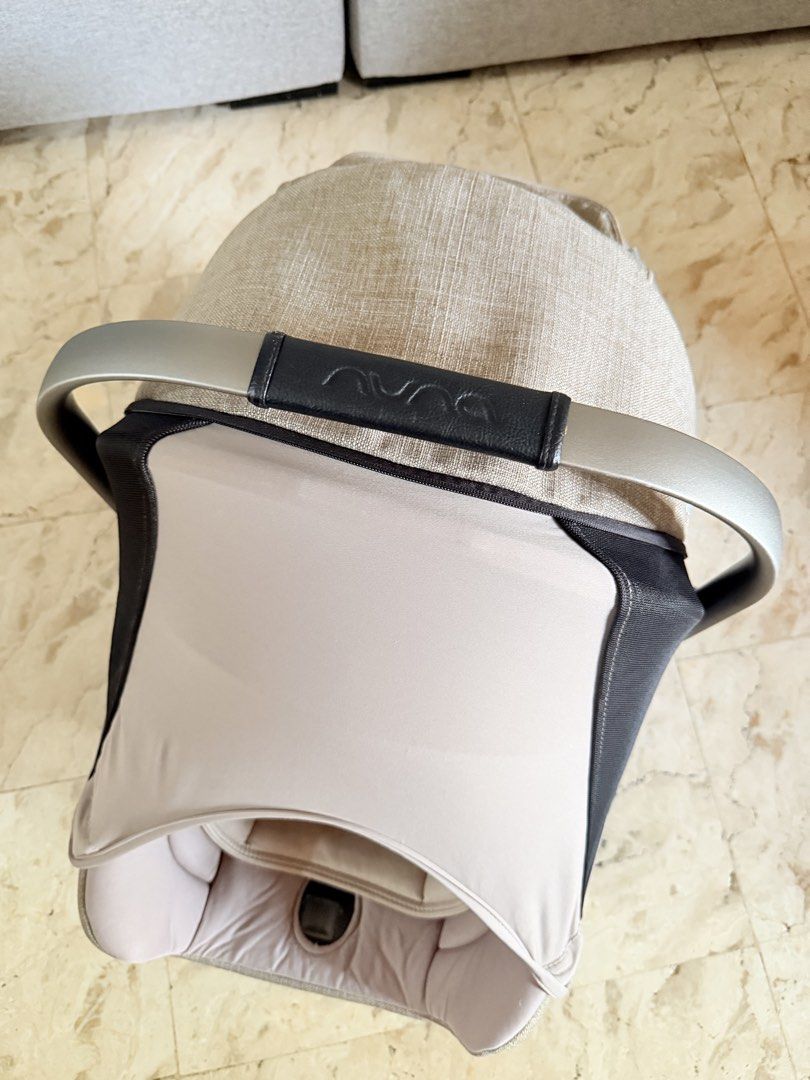 Nuna Pipa Infant Car Seat with Base (Category: Car Seats) located in Subic. Submitted by luxbytasha (Listing ID 1462755103, Image 3). Description: - Nuna Pipa infant car seat - Neutral beige and grey fabric - Includes canopy for sun protection - Features a 5-point harness for safety - Adjustable handle for convenience -Comes with base - Ideal for travel Issue: -minor scratches on handle and side only due to usage please see pictures.