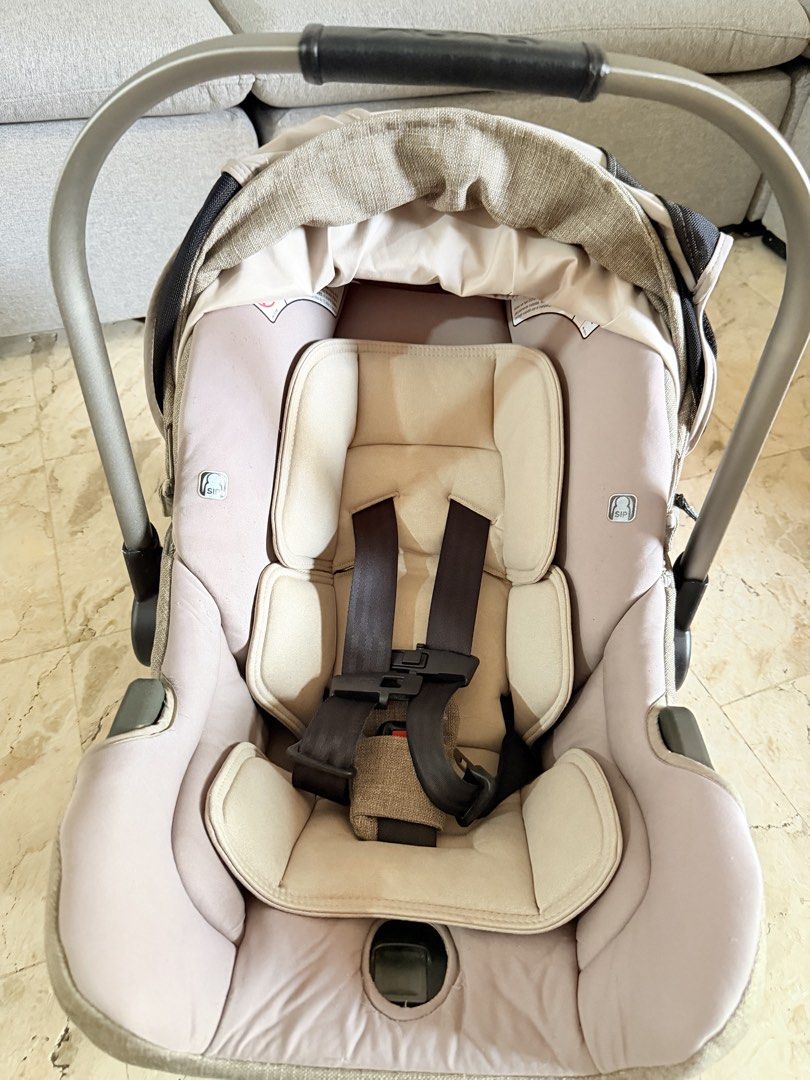 Nuna Pipa Infant Car Seat with Base (Category: Car Seats) located in Subic. Submitted by luxbytasha (Listing ID 1462755103, Image 2). Description: - Nuna Pipa infant car seat - Neutral beige and grey fabric - Includes canopy for sun protection - Features a 5-point harness for safety - Adjustable handle for convenience -Comes with base - Ideal for travel Issue: -minor scratches on handle and side only due to usage please see pictures.