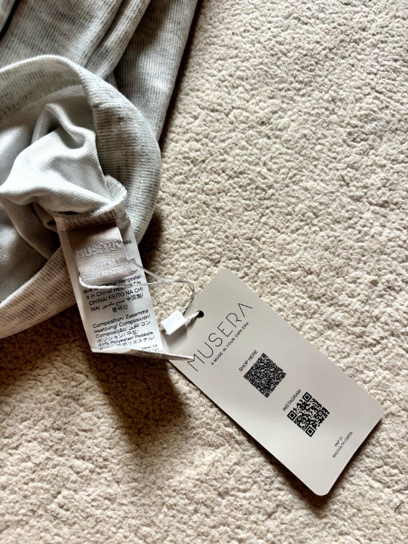 NUSERA Ribbed Button-Up Long Sleeve Cropped Cardigan (Category: Longsleeves) located in Cadiz. Submitted by soleil_montefalco (Listing ID 1462828879, Image 3). Description: - Brand: MUSERA - Color: Grey - Material: Ribbed knit - Style: Long sleeve cardigan - Fit: Cropped - Closure: Button-up front - Feel: Soft and comfortable - Versatile: Great for layering or wearing on its own - Styling Tip: Looks cute with high-waisted bottoms -Sizes are just 