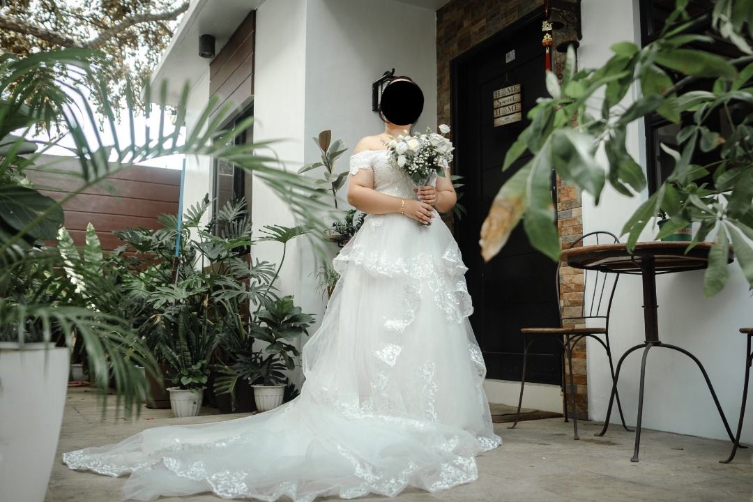 Off-Shoulder Tiered Wedding Gown with Train (Category: Evening dresses & gowns) located in Caloocan City. Submitted by wootwoot0101 (Listing ID 1462758851, Image 3). Description: - Beautiful off-shoulder wedding dress - Elegant tiered skirt and dramatic long train - Intricate lace and bead details on the bodice - Perfect for your dream wedding - Worn only once for ceremony and reception - Professionally cleaned and ready for its next bride with f