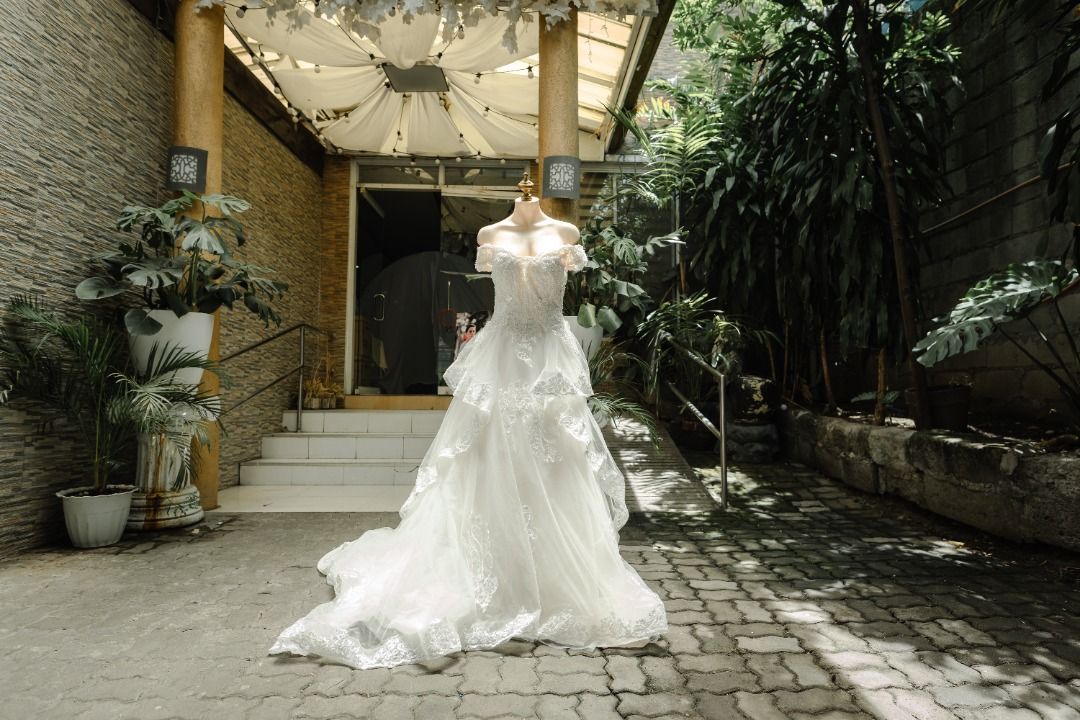 Off-Shoulder Tiered Wedding Gown with Train (Category: Evening dresses & gowns) located in Caloocan City. Submitted by wootwoot0101 (Listing ID 1462758851, Image 1). Description: - Beautiful off-shoulder wedding dress - Elegant tiered skirt and dramatic long train - Intricate lace and bead details on the bodice - Perfect for your dream wedding - Worn only once for ceremony and reception - Professionally cleaned and ready for its next bride with f