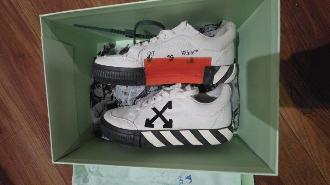 Off-White Low Top Sneakers White (Category: Sneakers) located in Quezon City. Submitted by jctan2019 (Listing ID 1462728194, Image 2). Description: - Authentic Off-White low top sneakers - Size: 35 - Color: White canvas with black accents - Condition: Super clean - Includes: Original box and dust bag - Features: Iconic Off-White zip tie - Origin: Made in Indonesia.