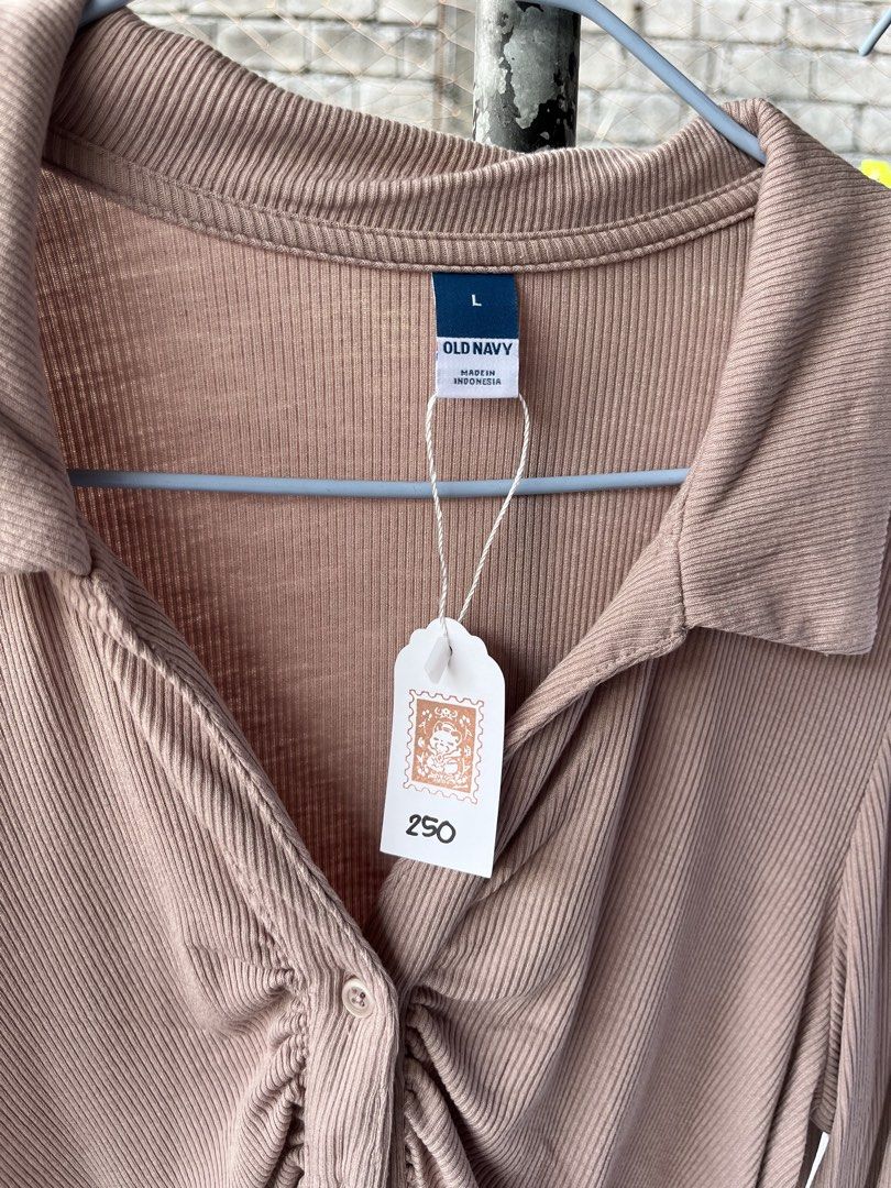 Old Navy Ribbed Pink Ruched Collared Long Sleeve (Category: Longsleeves) located in Dinalupihan. Submitted by penaflorcj (Listing ID 1462841262, Image 2). Description: - Pink ribbed long-sleeve top (also comes in white) -Collared neckline, button-up front, ruched detailing - Occasion: Perfect for casual wear or dressing up - Styling: Looks great with jeans or skirts rfs: decluttering *sale price + discount when you buy more than 2 items.
