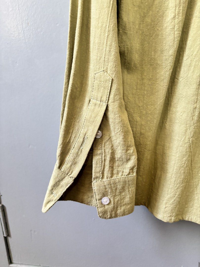 Olive Green Long Sleeve Button Up Shirt (Category: Community) located in Paranaque City. Submitted by ggg.bin (Listing ID 1462774864, Image 3). Description: - Olive green long sleeve shirt - Textured fabric - Button-up front with collar - Button cuffs with slit detail on sleeves - Estimated size: S - Ideal for casual outfits or layering.