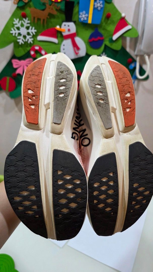 On Cloudboom Strike Running Shoes (Category: Sneakers) located in Quezon City. Submitted by iantonio (Listing ID 1462837181, Image 3). Description: - On Cloudboom Strike running shoes - Lightweight and responsive for optimal performance - Eye-catching gradient colorway (orange to purple) - "Cloudboom Strike" and "Swiss Engineering" branding visible - Excellent sole grip for secure footing - Size: EU 41 / UK 7.5 / US M8 Used only twice! Selling at