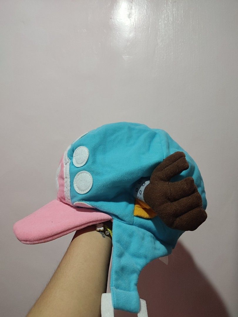 One Piece Chopper Hat Plush Cosplay (Category: Handmade Craft) located in Manila. Submitted by ailaarv (Listing ID 1462709925, Image 2). Description: COMIC ALLEY CHOPPER HAT 🥳 (user only once) - Super cute Chopper hat from One Piece - Made of soft plush material - Features iconic Chopper design with antlers and hat symbol - Ideal for cosplay or casual wear - Ear flaps provide warmth - Lined with pink fabric inside 📍 LAGUNA.