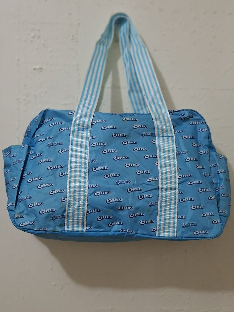 Oreo cookie brand tote or shoulder bag (Category: Shoulder Bags) located in Caloocan City. Submitted by pvaliao (Listing ID 1462827918, Image 1). Description: Promotional tote bag featuring an all over Oreo cookie brand pattern and striped shoulder handles. Material: heavy duty plastic fabric slightly glossy appearance Size: 14 inches × 10 inches Buy it now 😊 100 pesos only.