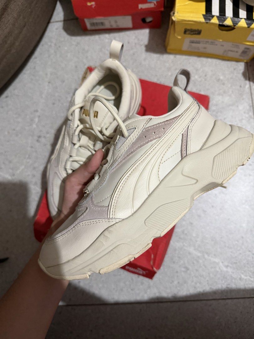 Original Puma Cream/Beige Chunky Sneakers (Category: Sneakers) located in Caloocan City. Submitted by rohllee (Listing ID 1462714556, Image 1). Description: - Cream and beige Puma sneakers - Chunky sole design - Lace-up closure with gold accent laces - Comfortable for everyday wear - Comes with original box Original Puma Sneakers Size: US 6; 22.5cm Location: Guadalupe, Makati.