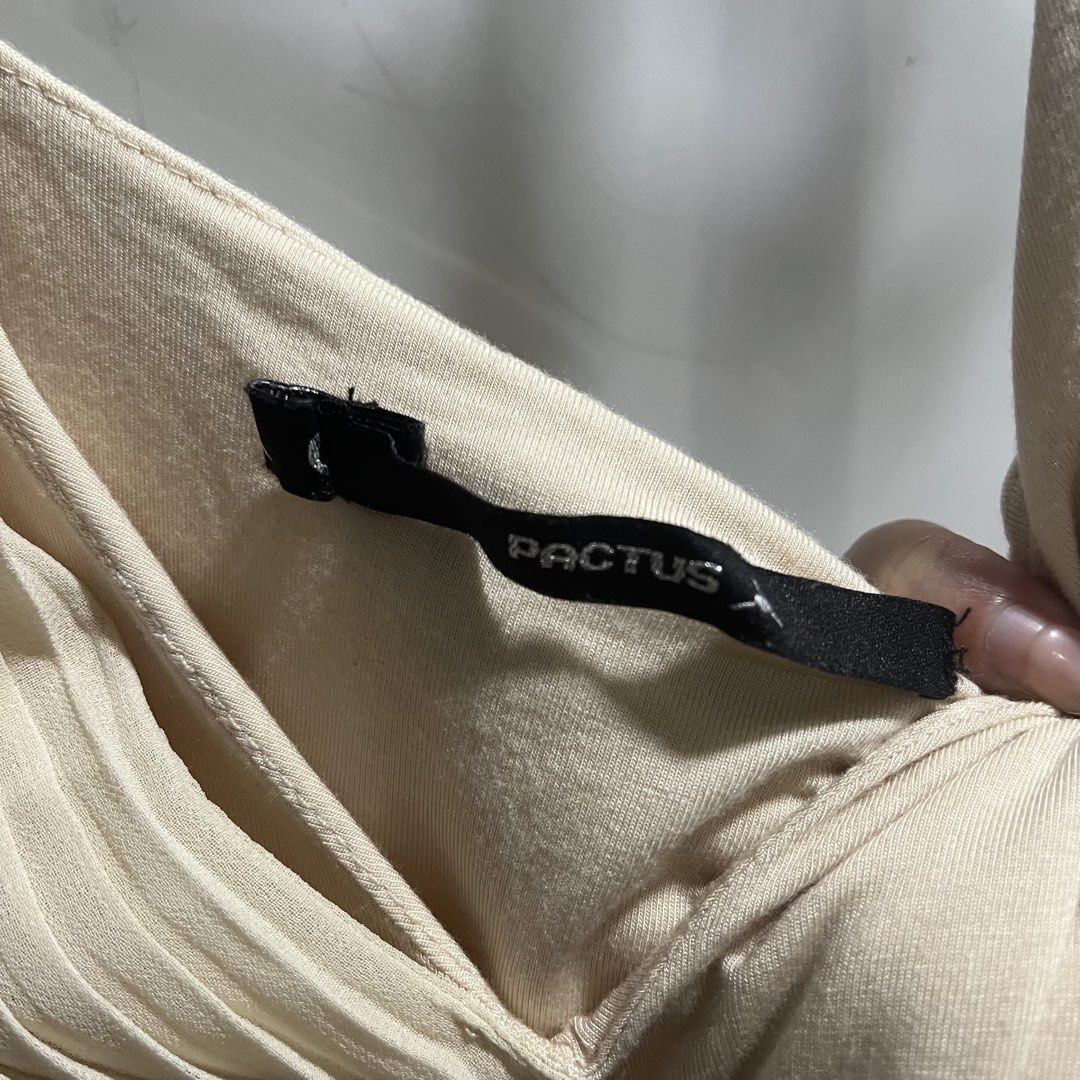 Pactus Ribbed Wrap Bodysuit Cream (Category: Others Tops) located in Manila. Submitted by 4ngeluh (Listing ID 1462684214, Image 2). Description: - Brand: Pactus - Color: Cream - Material: Ribbed fabric with good stretch - Style: Sleeveless wrap bodysuit - Neckline: Flattering V-neck - Versatility: Perfect for dressing up or down, ideal for layering or wearing solo.