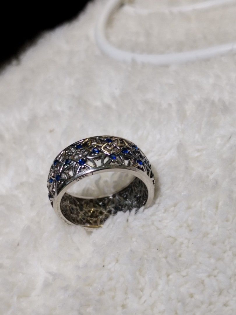 Pandora Silver Ring with Blue Stones (Category: Rings) located in Manila. Submitted by malditas (Listing ID 1462829173, Image 3). Description: - Silver-toned ring - Features intricate cut-out details - Small blue stones set within the pattern - Wide and decorative band - Adds a pop of color to any outfit - Approximately size 7 From HT box BUY AS IS (NO RETURN, NO EXCHANGE, NO REFUND unless stated) LOCATION For dropping: BAGUIO- Mabini LA TRINIDAD