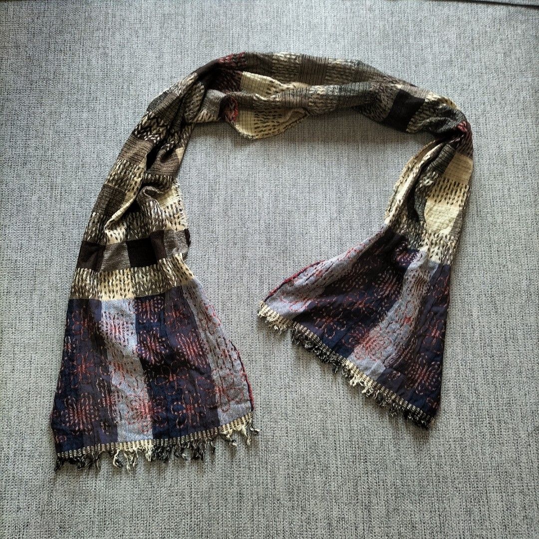 Patchwork Scarf with Fringed Ends (Category: Scarves) located in Taytay. Submitted by calmtree-6248 (Listing ID 1462807435, Image 1). Description: - Unique patchwork design - Mix of plaid and abstract patterns - Earthy tones, deep reds, and blues - Fringed edges for a bohemian look - Lightweight material, perfect for layering.