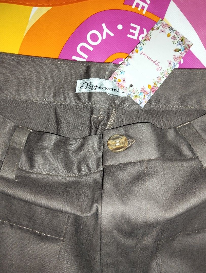 Peppermint High Waisted Cargo Pants size 29-30 (Category: Other Bottoms) located in Caloocan City. Submitted by girlshopmcollection (Listing ID 1462855364, Image 2). Description: - Brand: Peppermint - Color: Brown - Style: High-waisted pants - Pockets: Two large front pockets, two back pockets - Closure: Button and zip - Material: Sturdy, durable fabric - Occasion: Great for casual wear.