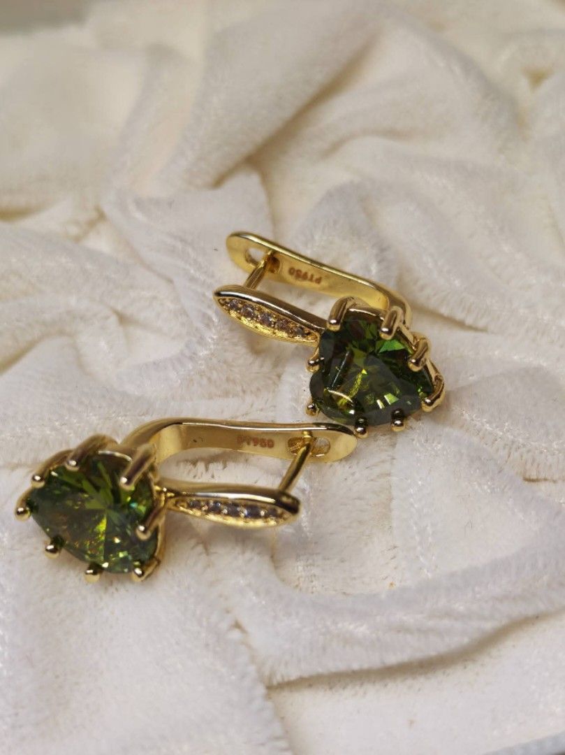 Peridot earrings PT950 with Diamond Accents (Category: Earrings) located in Mandaue City. Submitted by chuchi152615 (Listing ID 1462850159, Image 2). Description: - Beautiful gold earrings - Features heart-shaped green gemstones - Accented with small diamonds - Secure lever back closure - Eye-catching and versatile - Comes in a nice gift box.