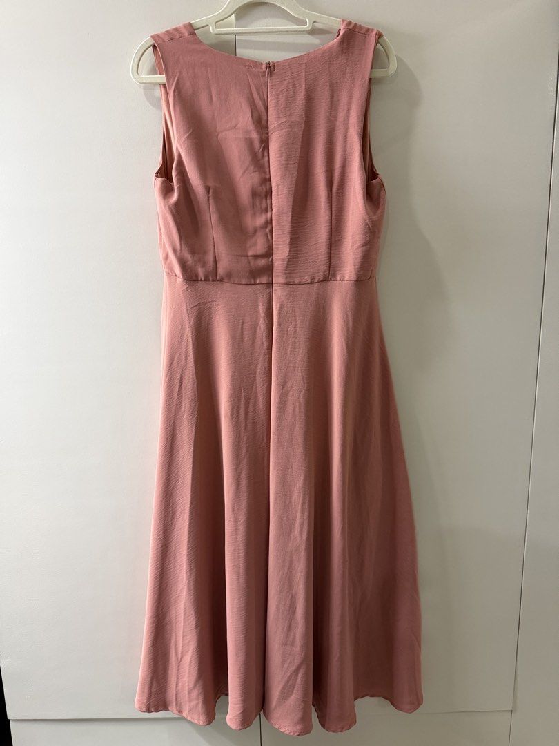 Pink Button Front Midi Dress (Category: Dresses) located in Rosario. Submitted by lovedtwiceph (Listing ID 1462799294, Image 2). Description: - Sleeveless pink midi dress - Flattering V-neck with button details - Comfortable elasticated waist - Flowy, flared skirt - Easy back zipper closure - Versatile: great for casual or dressed-up looks.