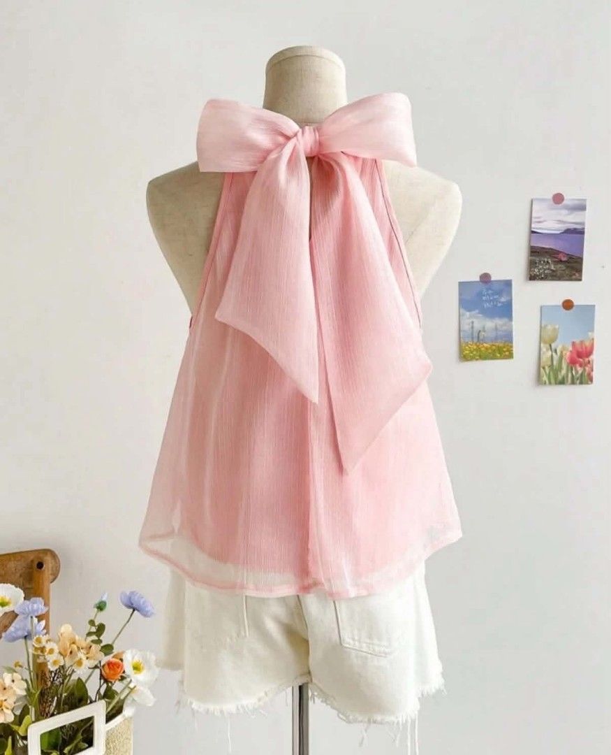 Pink Halter Top with Back Bow Detail (Category: Sleeveless) located in Paranaque City. Submitted by lizzyscloset01 (Listing ID 1462795379, Image 2). Description: - Cute pink halter neck top - Lightweight fabric with a nice drape - Features a big bow tie at the back - Ideal for casual outings or beach trips - Easily pairs with shorts or skirts - Enjoy the flowy fit.