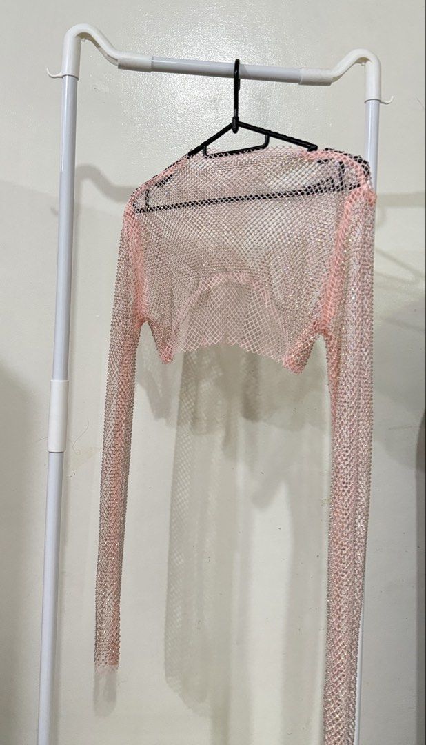 Pink Rhinestone Mesh Crop Top Long Sleeve (Category: Longsleeves) located in Manila. Submitted by lovedbyan (Listing ID 1462877993, Image 1). Description: -₱100 -XS-S - Super cute pink mesh crop top - Covered in sparkly rhinestones - Long sleeves - Perfect for layering - Ideal for parties, festivals, or nights out - Adds glam to any outfit.