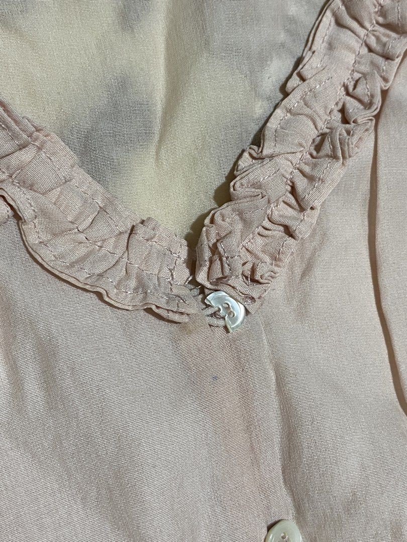 Pink Ruffled V-Neck Short Sleeve Blouse Polo (Category: Blouses) located in Manila. Submitted by faerikhae (Listing ID 1462829483, Image 2). Description: FLAW: 1 broken button only the fabric is like chiffon type a bit see through .