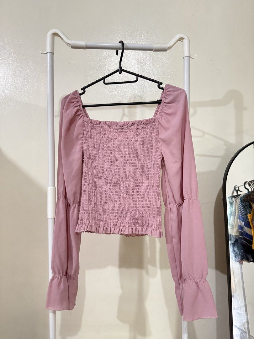 Pink Smocked Square Neck Puff Sleeve Top (Category: Blouses) located in Manila. Submitted by lovedbyan (Listing ID 1462879648, Image 2). Description: -₱100 -Genevieve Gozum - Adorable pink top with a trendy smocked bodice. - Features a flattering square neckline. - Stylish puff sleeves with flared cuffs. - Made from lightweight and flowy fabric for comfort. - Pairs beautifully with jeans or skirts..
