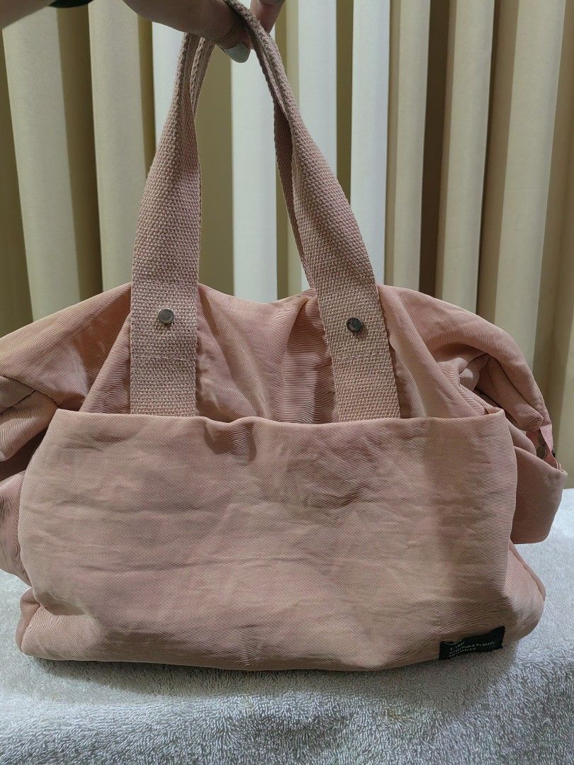 Pink Tote Bag with Shoulder Strap (Category: Tote Bags) located in Makati City. Submitted by prelovedtreatedwithlove (Listing ID 1462861711, Image 2). Description: - Adorable pink tote bag - Multiple interior pockets for organization - Comfortable top handles - Includes a detachable shoulder strap for versatility - Secure zip-top closure - Durable canvas-like material - Ideal for everyday errands or travel - Issue last 2 pics for reference but st