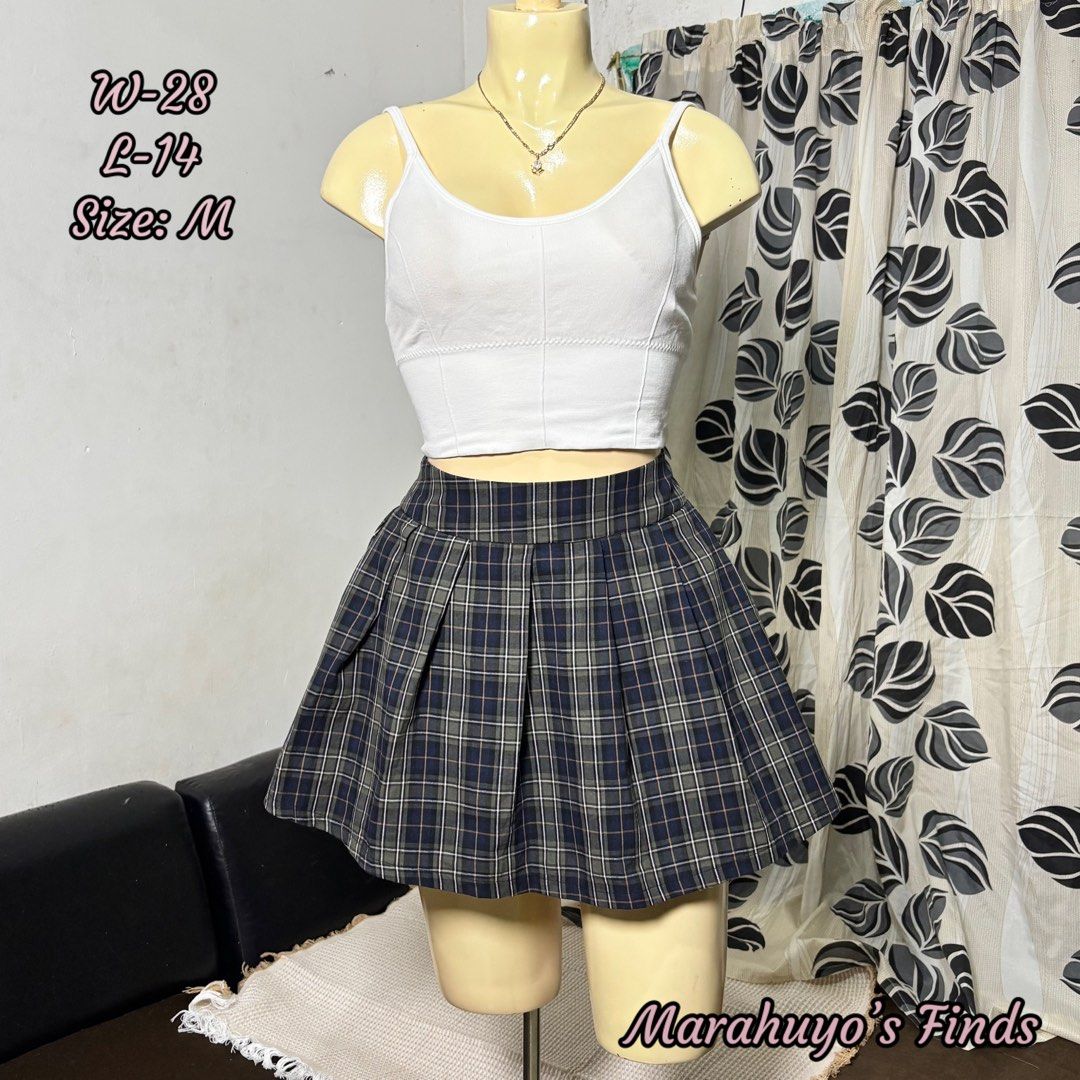 Plaid Pleated Mini Skirt - Size M (Category: Skirts) located in Mabalacat. Submitted by marahuyos.finds (Listing ID 1462848432, Image 1). Description: - Cute plaid pleated mini skirt - Dark navy with grey and white plaid pattern - High-waisted style - Versatile: pairs well with crop tops or t-shirts - Ideal for casual or preppy looks - Size: Medium (M).