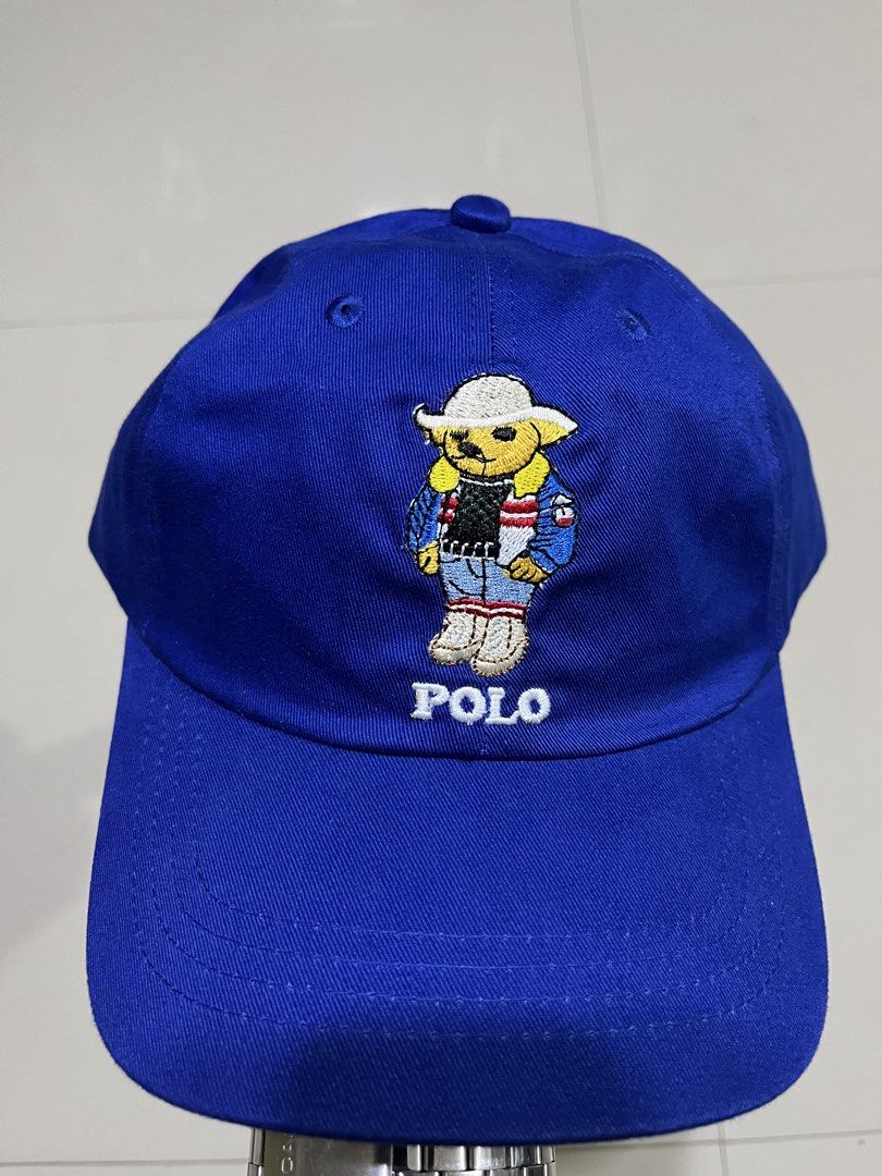 Polo Ralph Lauren Bear Cap Blue (Category: Caps & Hats) located in Quezon City. Submitted by flip_da_cash (Listing ID 1462861780, Image 2). Description: Blue Polo Ralph Lauren Cap - Features iconic Polo Bear graphic on the front - 'POLO' text embroidered below the bear - 'POLO RALPH LAUREN' embroidered on the back - Adjustable strap with buckle closure.