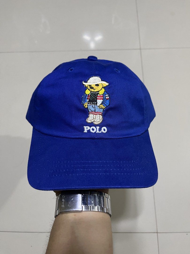 Polo Ralph Lauren Bear Cap Blue (Category: Caps & Hats) located in Quezon City. Submitted by flip_da_cash (Listing ID 1462861780, Image 1). Description: Blue Polo Ralph Lauren Cap - Features iconic Polo Bear graphic on the front - 'POLO' text embroidered below the bear - 'POLO RALPH LAUREN' embroidered on the back - Adjustable strap with buckle closure.