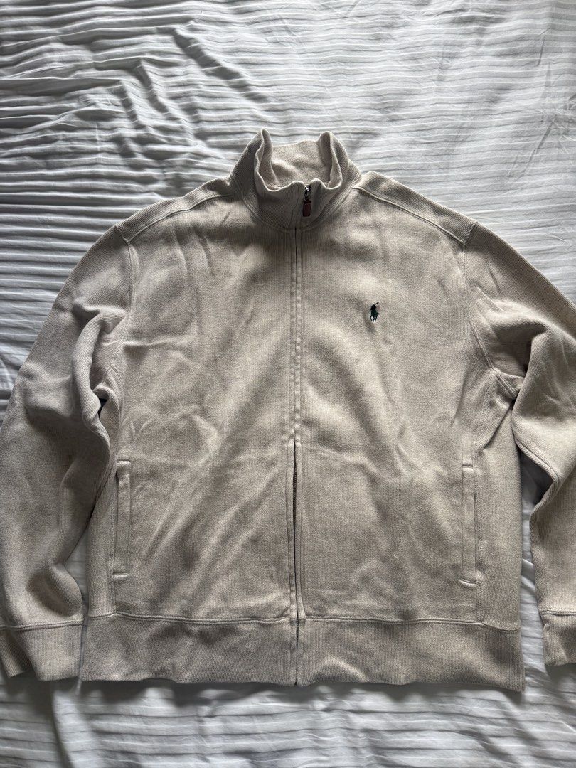 Polo Ralph Lauren Zip Up Jacket Size L (Category: Coats, Jackets and Outerwear) located in Makati City. Submitted by lgramos1496 (Listing ID 1462727901, Image 1). Description: Vintage RL zip up sweater - hand me down from my dad - Light beige Polo Ralph Lauren zip-up jacket - Classic embroidered pony logo on chest - Full zip closure with leather pull tab - Ribbed collar, cuffs, and hem - Two side pockets - Ideal for layering wardrobe Rfs: declute