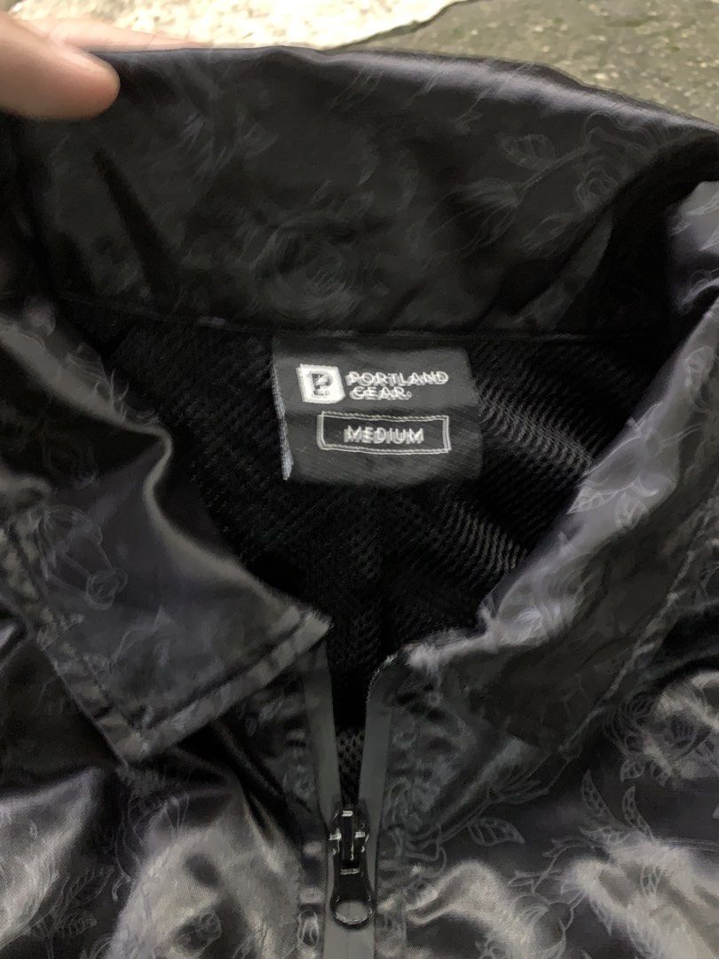 Portland Gear Black Rose Pattern Coach Jacket Medium (Category: Coats, Jackets and Outerwear) located in Manila. Submitted by thrift2mnla (Listing ID 1462812018, Image 3). Description: - Portland Gear black coach jacket - Subtle all-over rose pattern - Full zip closure - Front pockets - Ribbed cuffs with green and white stripes - 'P' logo on left sleeve - Ideal for layering.