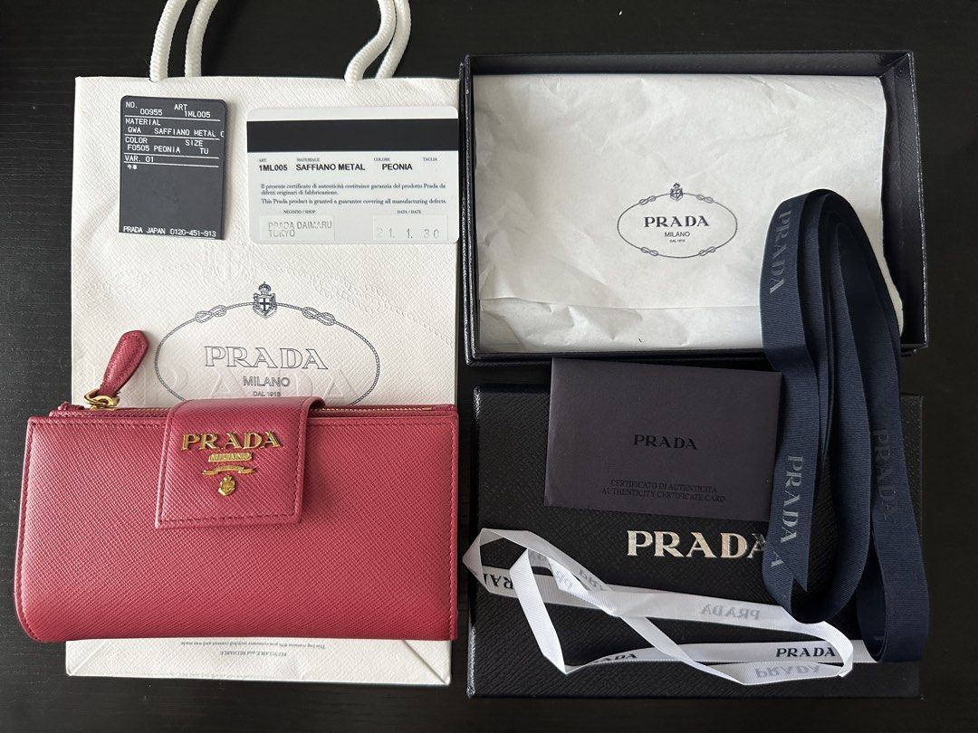 Prada Bi-fold wallet - 1ML005 Pink Leather (Category: Luxury Bags & Wallets) located in Las Pinas. Submitted by daisuki_japan_luxury_by_reiko (Listing ID 1460525410, Image 1). Description: Condition Notes [Exterior] Overall ⇒ Metal deterioration [Interior] Inside of coin purse ⇒ Stains Overall ⇒ Stains / Loss of shape / Discoloration / Fading (Fading) Outside of coin purse ⇒ Fabric deterioration brand PRADA Genre Bi-fold wallet Model number 1ML00