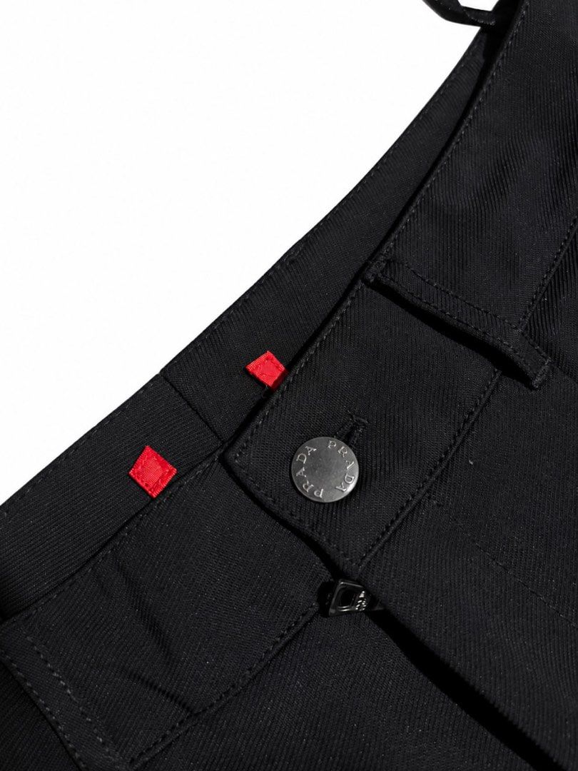 Prada Black Pants (Category: Other Bottoms) located in Manila. Submitted by na2oy777 (Listing ID 1462685667, Image 2). Description: - Authentic Black Prada Pants - Secure button and zip closure - Distinctive red square details on waistband - Convenient inner pockets - Perfect for both casual and formal styling.