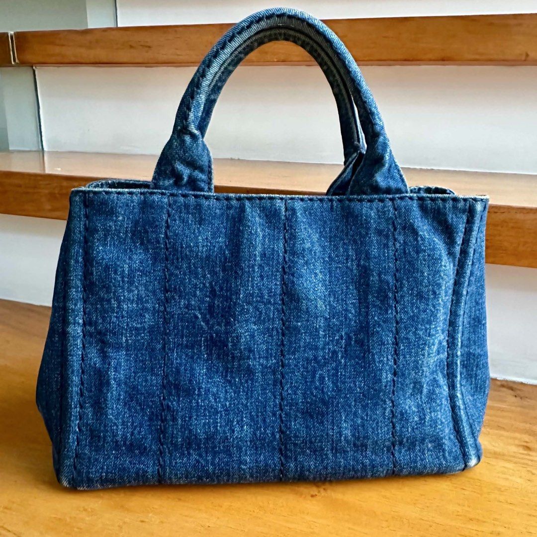 Prada Canapa (Category: Luxury Bags & Wallets) located in Muntinlupa City. Submitted by mabelleadr46801 (Listing ID 1462765208, Image 3). Description: Prada Handbag or Crossbody Bag, made of denim, featuring the iconic hardware design. Casual and fashionable, enhancing personal charm and appeal, very suitable for daily outings or dates, in overall very good condition. Dimensions: Width: 28cm Depth: 15cm Height: 19cm.