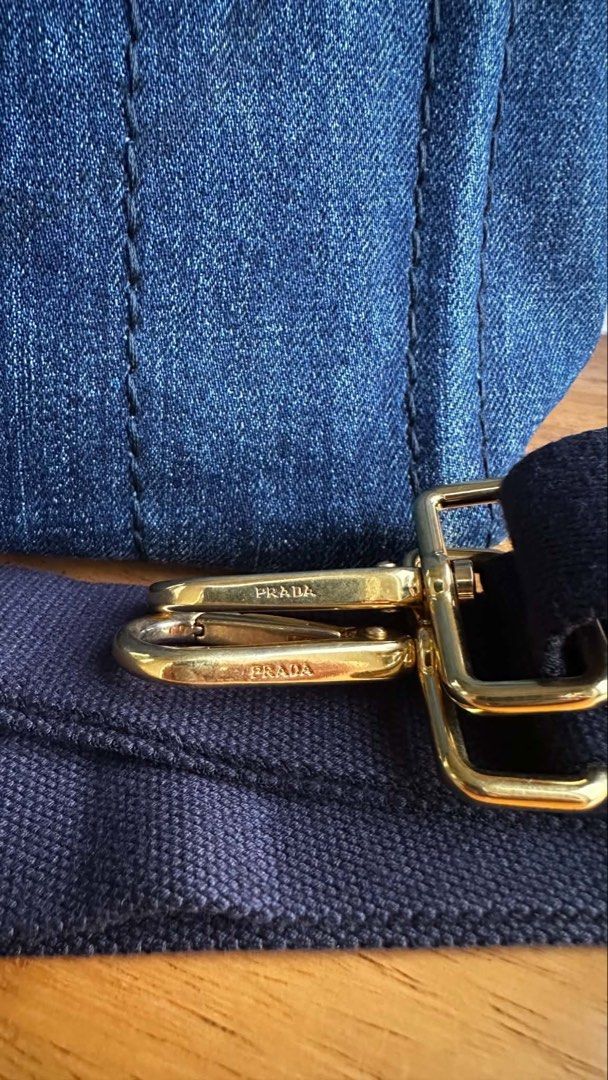 Prada Canapa (Category: Luxury Bags & Wallets) located in Muntinlupa City. Submitted by mabelleadr46801 (Listing ID 1462765208, Image 2). Description: Prada Handbag or Crossbody Bag, made of denim, featuring the iconic hardware design. Casual and fashionable, enhancing personal charm and appeal, very suitable for daily outings or dates, in overall very good condition. Dimensions: Width: 28cm Depth: 15cm Height: 19cm.